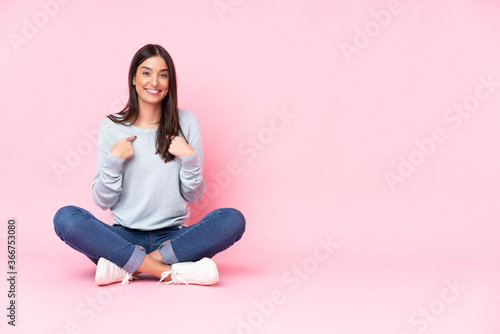 Young caucasian woman isolated on pink background with surprise facial expression
