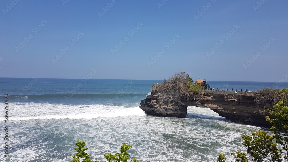 Tanah Lot temple with ocean view, sea view, water view, a rock formation off the Indonesian island of Bali Island, Indonesia