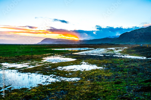 A few ponds on the plain in the south of Iceland at sunset