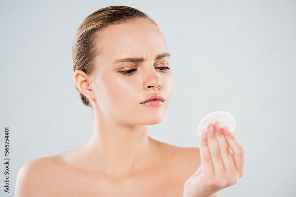 naked young woman looking at cotton pad isolated on grey naked young woman looking at cotton pad isolated on grey