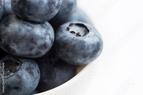 Fresh blueberry close-up isolated on a white background. Shallow depth of field. Healthy and dietary food concept. Fresh berries.