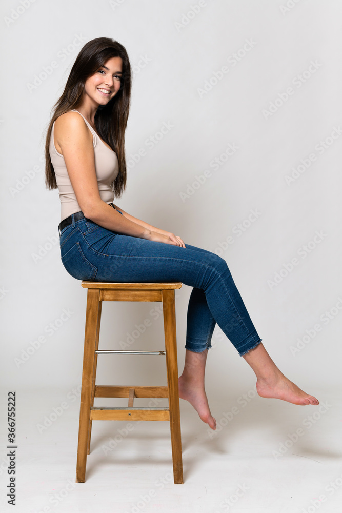 Teenager Brazilian girl over isolated background Teenager Brazilian girl over isolated background