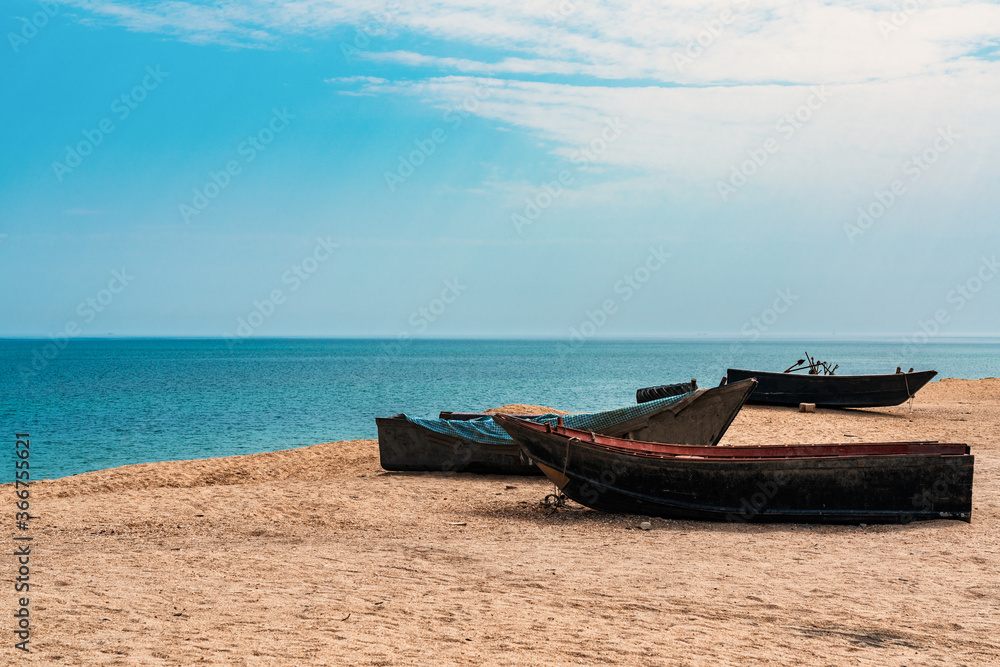 Fishing boats by the sea