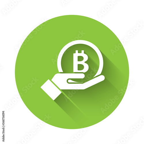 White Hand holding Bitcoin icon isolated with long shadow. Blockchain technology, digital money market, cryptocoin wallet. Green circle button. Vector.