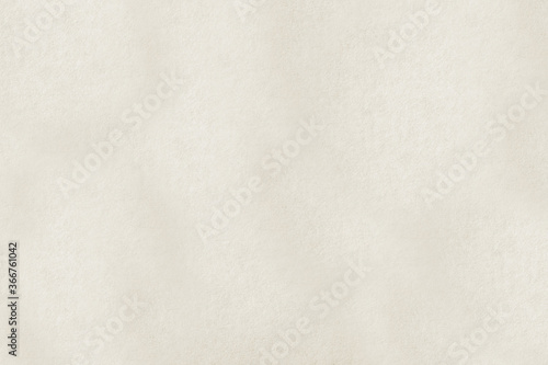 A rough sheet of beige paper.Texture or background