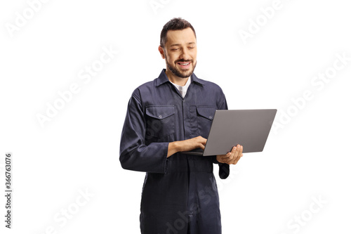 Auto mechanic working on a laptop computer