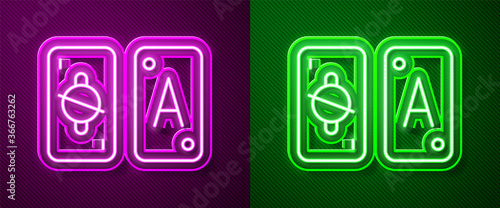 Glowing neon line Tarot cards icon isolated on purple and green background. Magic occult set of tarot cards. Vector.