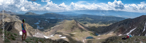 Trail runner woman running with view of river and trail path