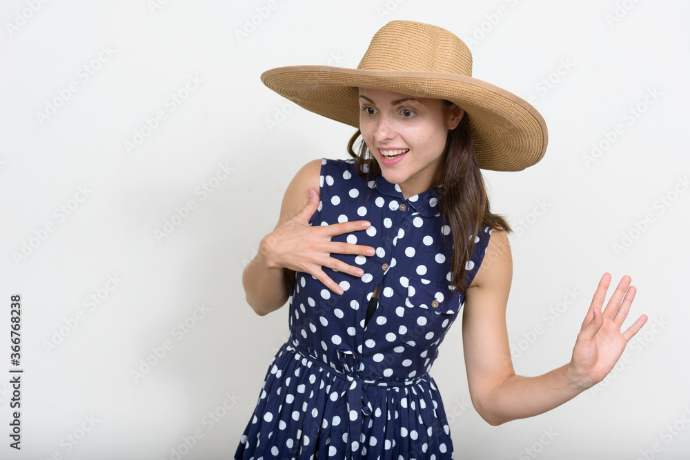 Portrait of young beautiful tourist woman against white background Portrait of young beautiful tourist woman against white background