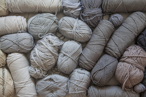 gradient from yarn of natural bright shades. White, beige, gray, black and cream colors.