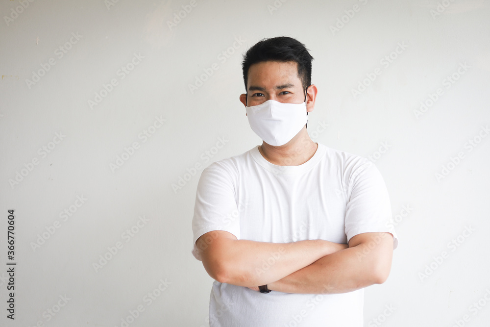 Asian handsome man on white shirt with facemask on white background Asian handsome man on white shirt with facemask on white background