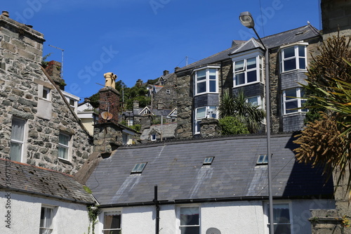 A jumble of traditional cottages and  houses on a steep hill in central Barmouth, Gwynedd, Wales, UK. photo