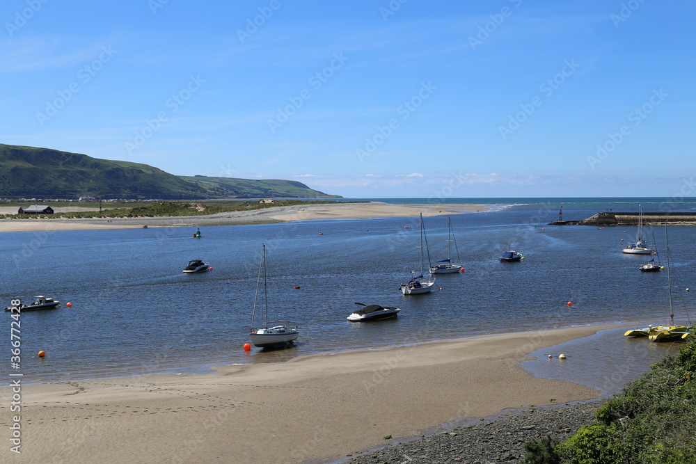 Yachts moored in the Mawddach Estuary at Barmouth, Gwynedd, Wales, UK. Yachts moored in the Mawddach Estuary at Barmouth, Gwynedd, Wales, UK.