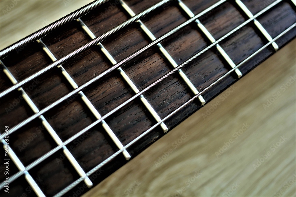 Bas-guitar. Bass guitar neck. Bass strings. Musical instrument. Music Bas-guitar. Bass guitar neck. Bass strings. Musical instrument. Music