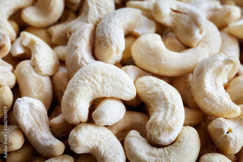 Close up picture of dry natural cashew nuts, selective focus.