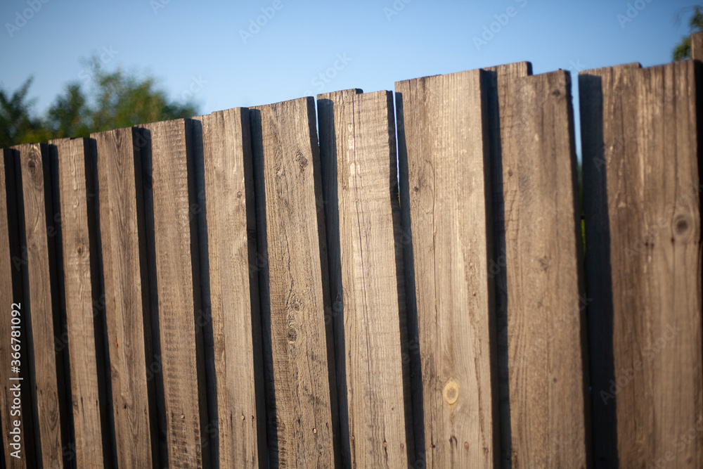 Old wooden fence on the street. Old wooden fence on the street.