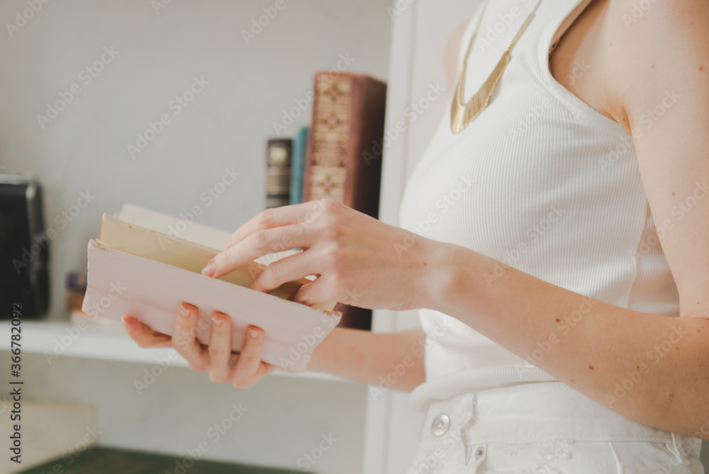 Beautiful young woman with book