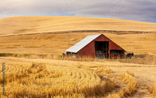 A red barn in the fall season in the palouse wheat country in southeastern Washington.