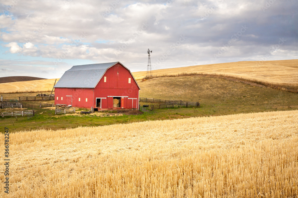 A red barn in the fall season in the palouse wheat country in southeastern Washington.