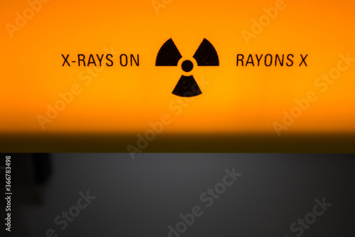 Orange and black x-ray warning sign in a science laboratory