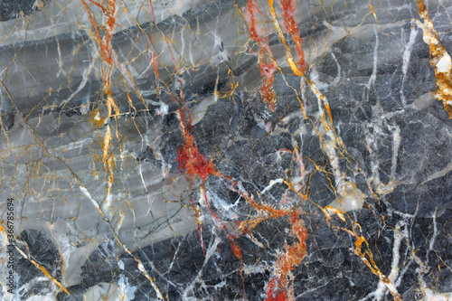 Red, white and yellow patterned natural of dark gray marble texture, abstract background