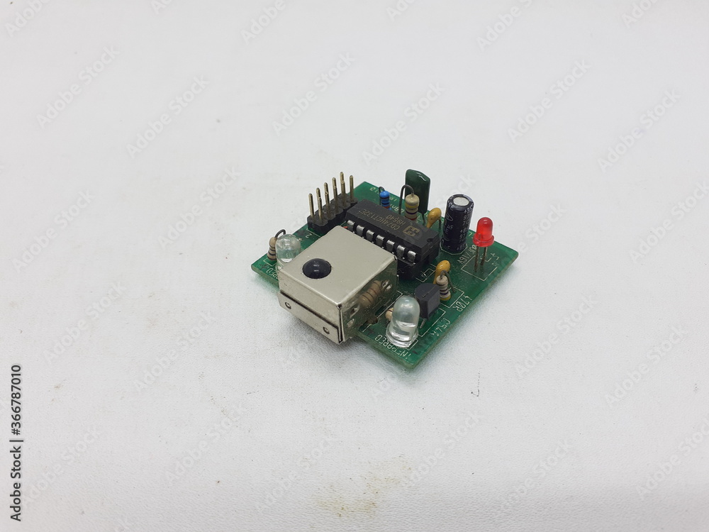 Industrial Electronic Printed Circuit Board with Data Sensors Application in White Isolated background Industrial Electronic Printed Circuit Board with Data Sensors Application in White Isolated background