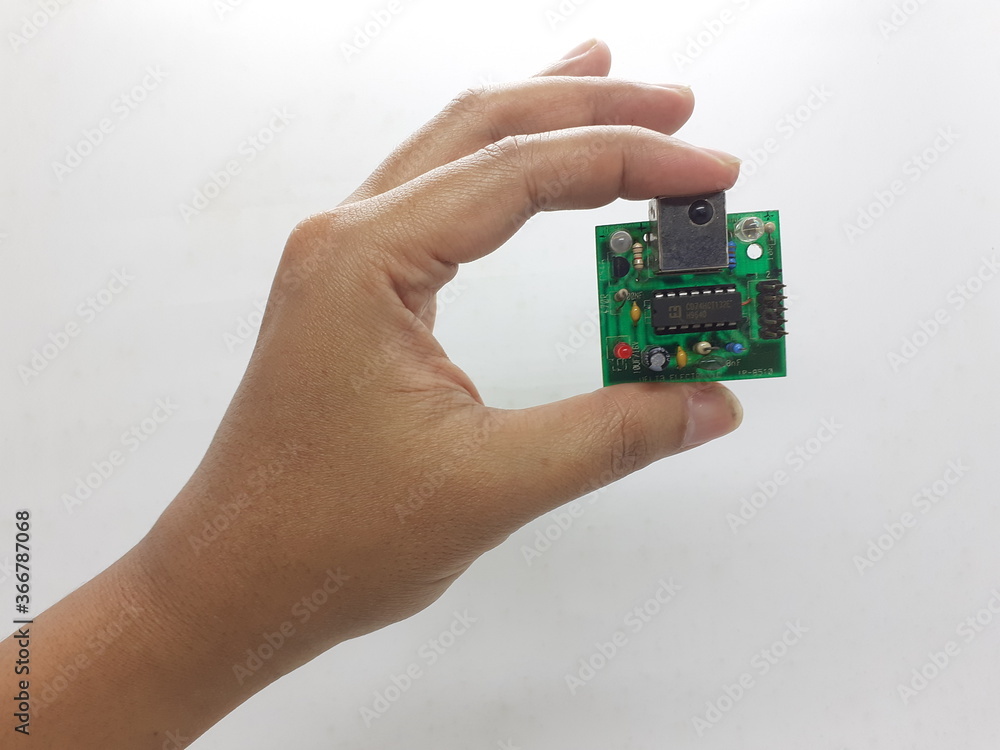 Industrial Electronic Printed Circuit Board with Data Sensors Application in White Isolated background Industrial Electronic Printed Circuit Board with Data Sensors Application in White Isolated background