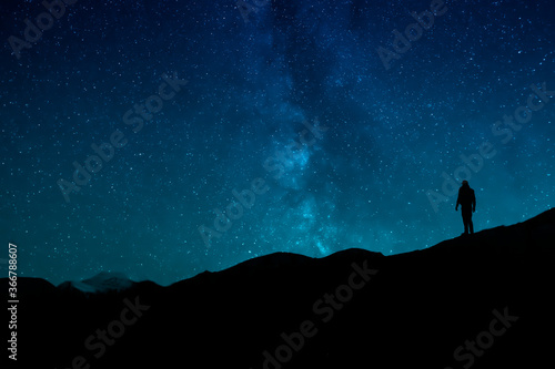 Man Standing Under The Stars At Night