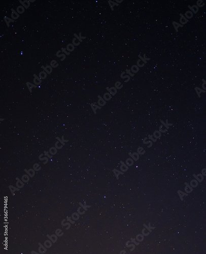 Space background on the desktop, screensaver. Night starry sky of the Northern hemisphere. Various cosmic bodies and constellations. The stars are like small bright lights.