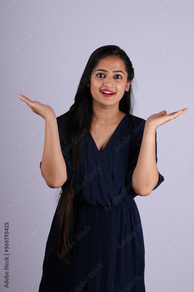 Excited young woman against white background Excited young woman against white background