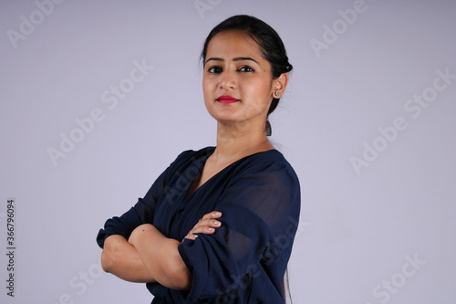 Beautiful and confidant Indian woman or girl with hands folded or crossed