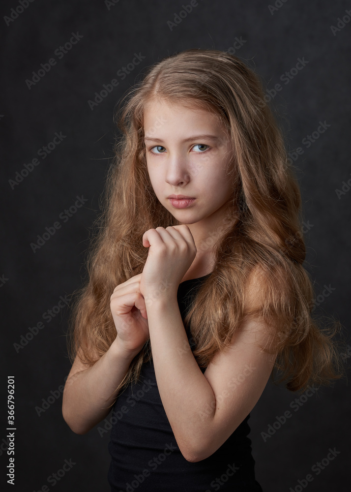 Portrait of a young long haired girl looking at camera Portrait of a young long haired girl looking at camera