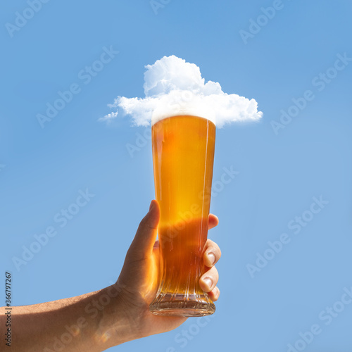 Man holding beer glass with cloud on it
