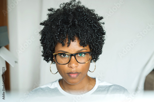 Young smart black woman wearing glasses