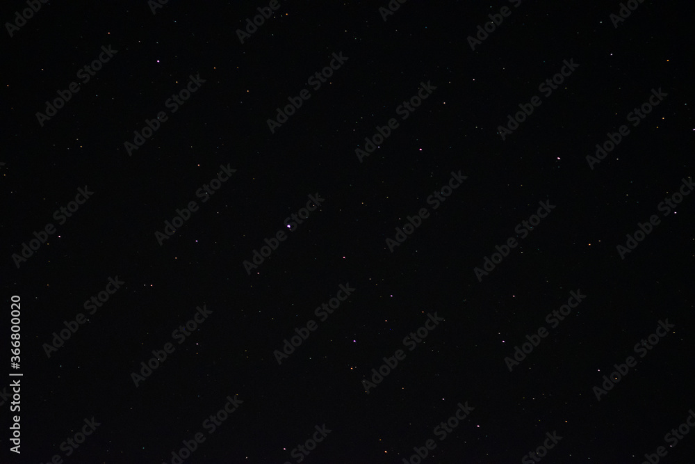 Space background on the desktop, screensaver. Night starry sky of the Northern hemisphere. Various cosmic bodies and constellations. The stars are like small bright lights.