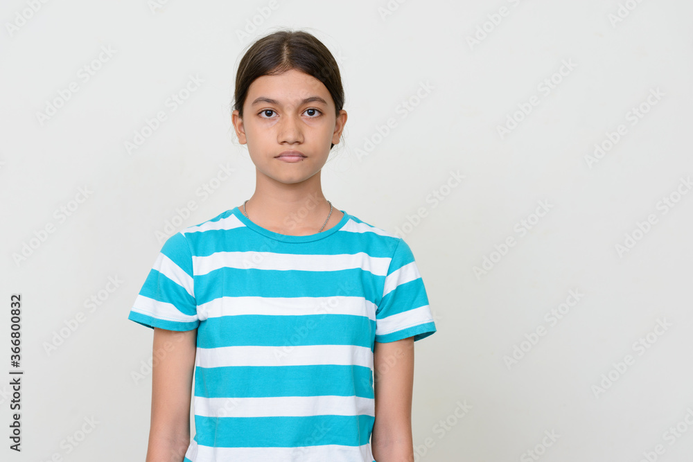 Portrait of young Asian teenage girl against white background Portrait of young Asian teenage girl against white background