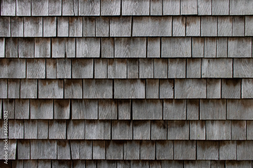 wooden siding shingles on a cape cod home photo