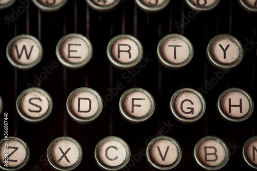 High angle of old fashioned typewriter with keys with letters and numbers photo