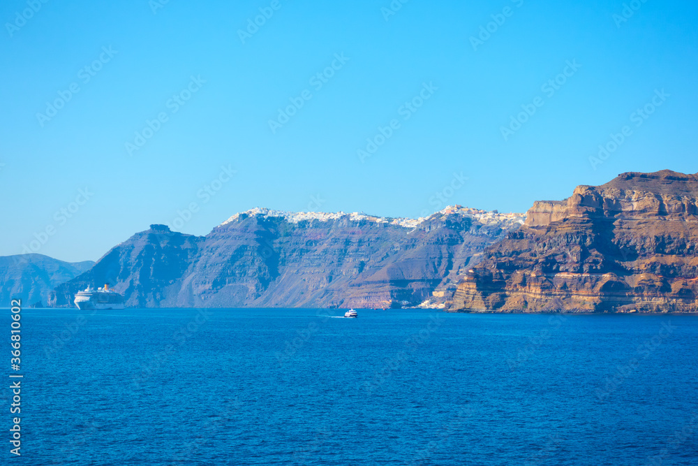 Aegean Sea with Santorini shore and Fira town