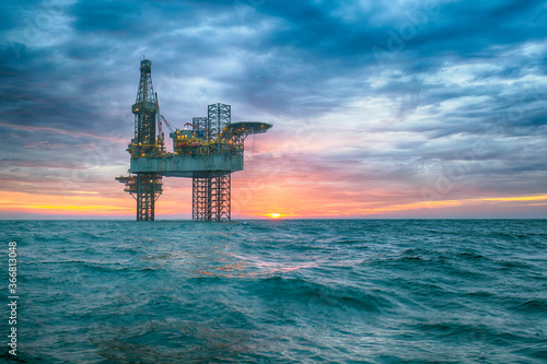 Oil rig at sunset time photo