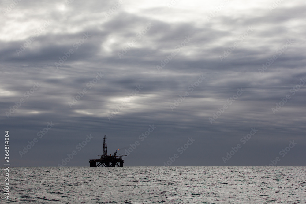 Silhouette of offshore oil installation