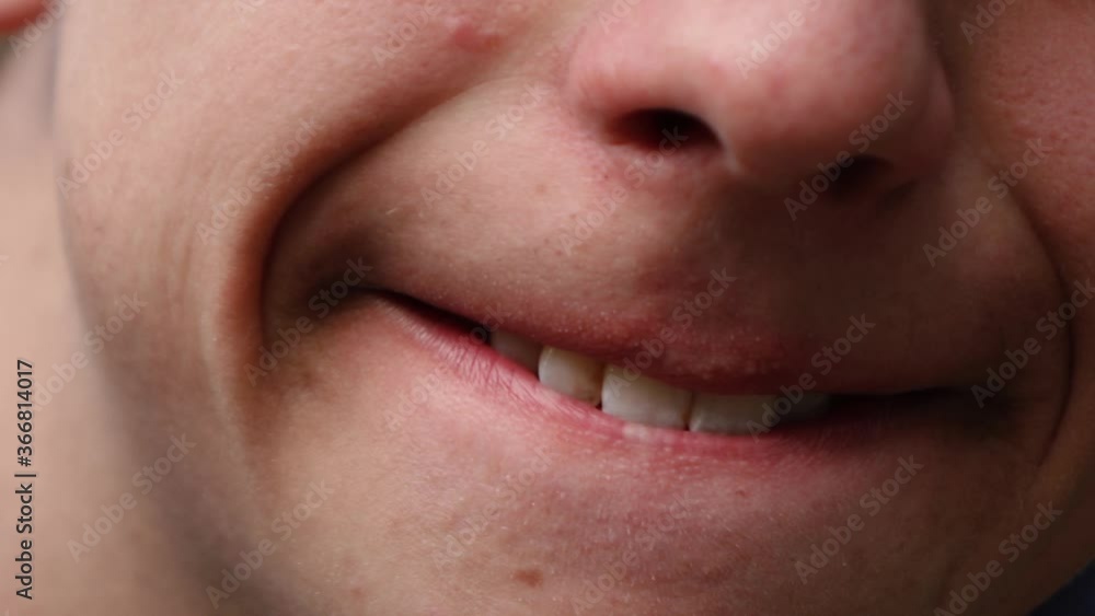 close-up of a smiling person's face close-up of a smiling person's face