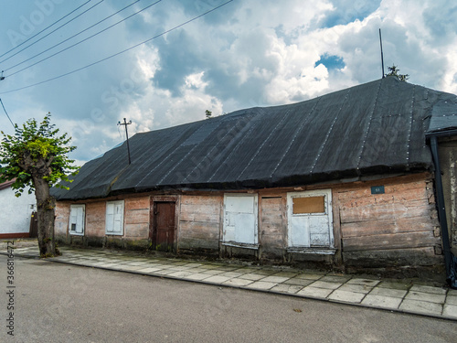 An old abandoned wooden cottage with a tar paper roof, Wyszogród, Poland