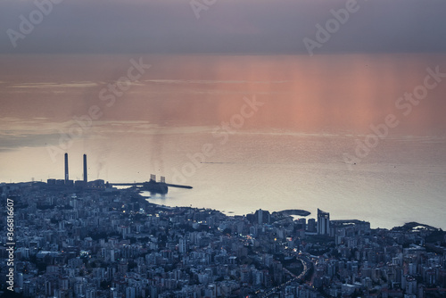 Sunset over Mediterranean Sea coast in Lebanon, view with Zouk Power Plant in Zouk Mikael city photo