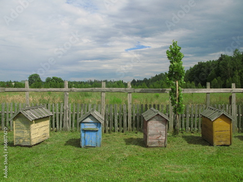 Painted wooden colorful beehives in the open-air museum Sioło Budy, Podlasie Province, Poland