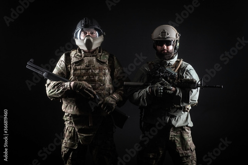 American special forces, two soldiers in military uniform with weapons on a dark background, elite troops, armed rangers at night
