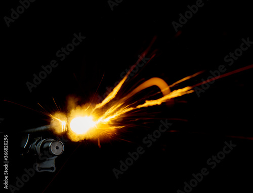 Realistic shotgun shot with muzzle flash photo