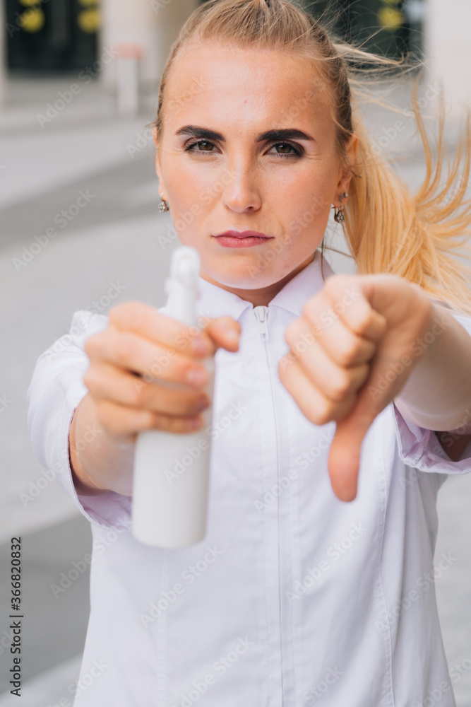 spraying hands with an antiseptic spray close-up on a light background disinfection spraying hands with an antiseptic spray close-up on a light background disinfection