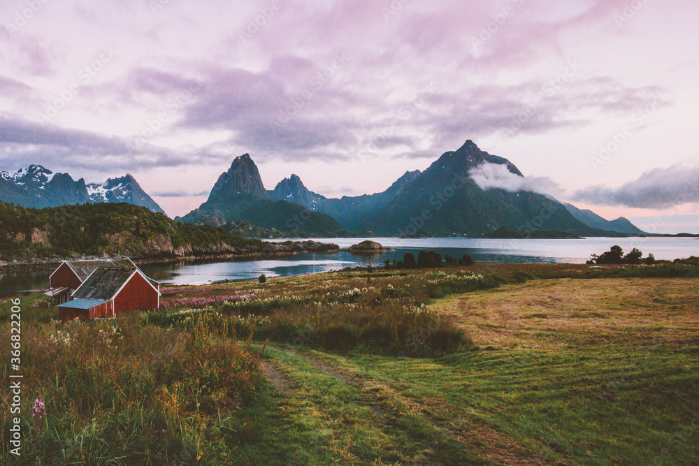 Norway landscape sunset mountains above fjord and village houses in Lofoten islands rural scandinavian nature travel beautiful destinations countryside. Norway landscape sunset mountains above fjord and village houses in Lofoten islands rural scandinavian nature travel beautiful destinations countryside.