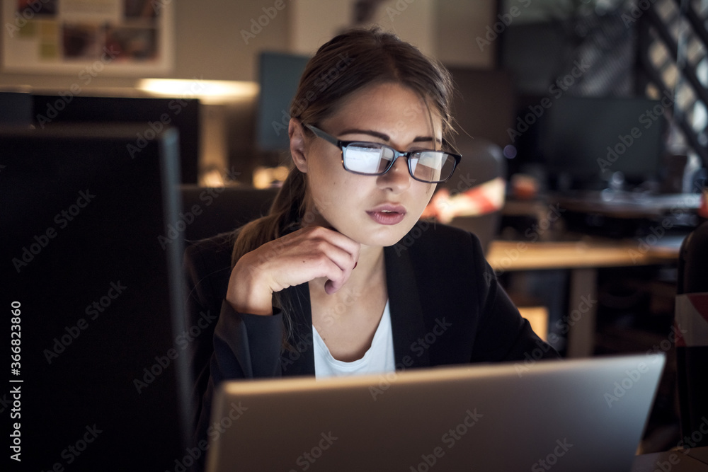 Girl with glasses in business clothes. Works on the computer. Girl with glasses in business clothes. Works on the computer.